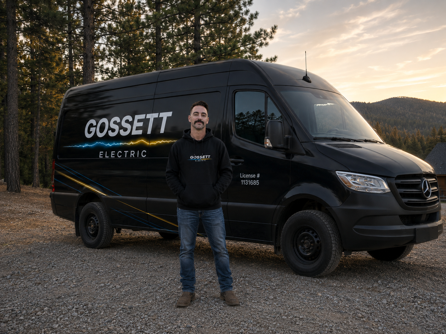 Cody Gossett standing with the Gossett Electric service van at a mountain jobsite